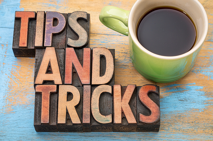 Coffee on table next to "Tips and Tricks" in block letters